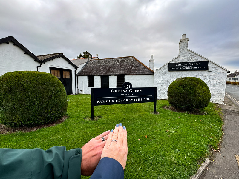 Couple holding hands at Gretna Green, Scotland