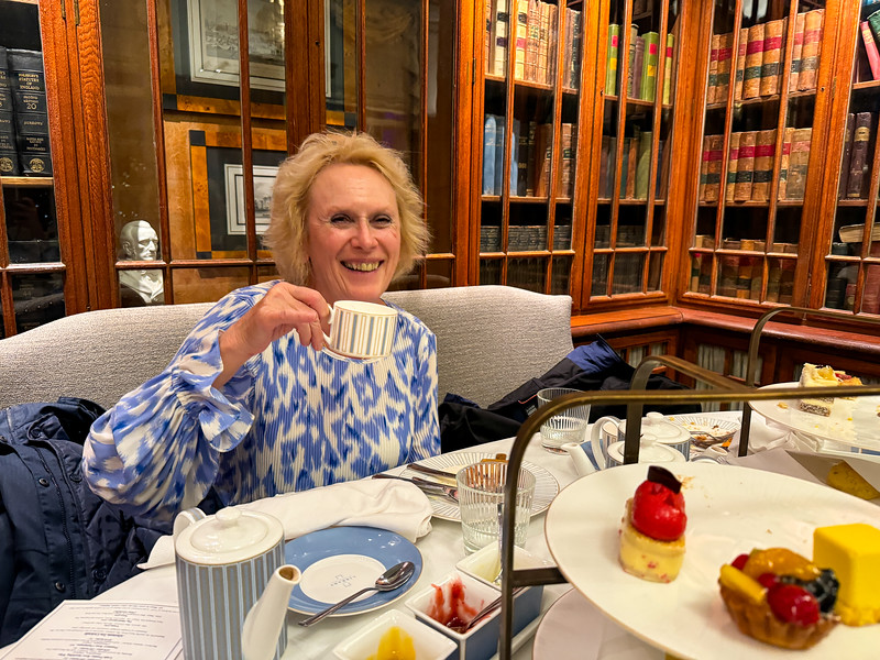 Woman having afternoon tea in London, England